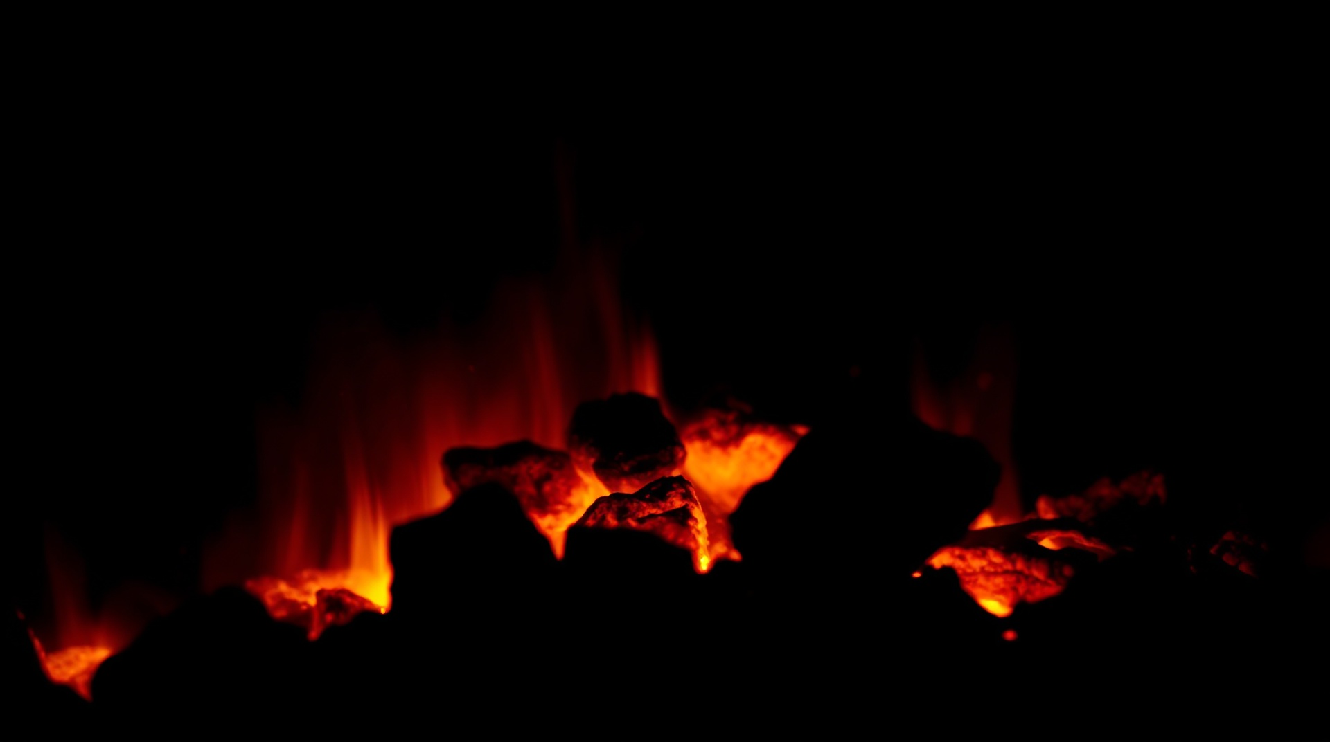 A bed of embers burning down to cooking heat