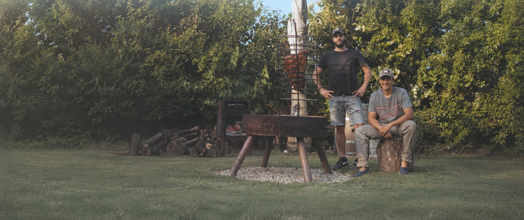 A La Cruz founders with a handcrafted grill
