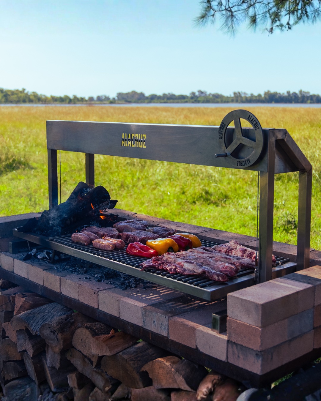 A Facón open fire grill loaded with meat over a bed of coals